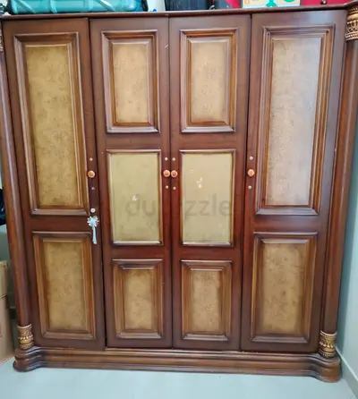 Large Wooden 4-Door Wardrobe with Carved Details