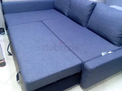 Blue L-shaped Sofa Bed — Convertible with Storage, Good Condition