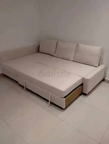Beige L-shaped Sofa Bed with Storage - Good Condition