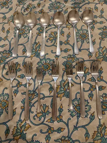 Set of 7 stainless steel forks and 6 teaspoons