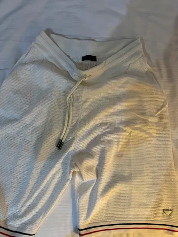 Size XL Prada mesh shorts in a crisp off-white/cream colorway
