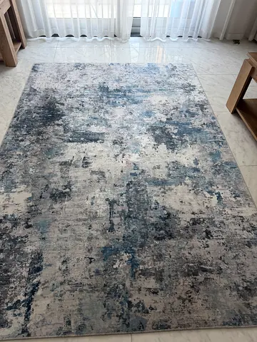 Large modern abstract area rug in blue and grey tones