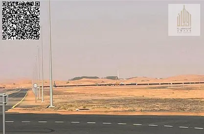 Industrial land for sale in Sharjah, Al Qasimia Industrial Area, Phase 4. Land area: 11,945 sq ft (1,110 sq m). The land has a building permit for fa