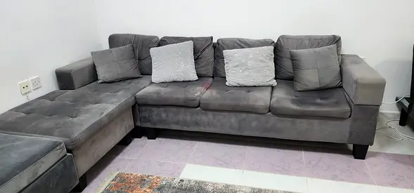Grey L-shaped Fabric Sofa with Ottoman - Good Condition