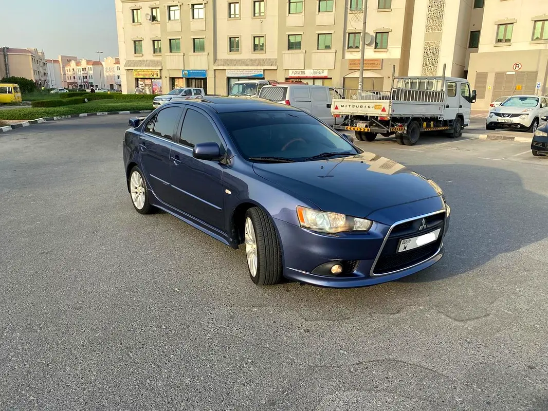Mitsubishi Lancer EX 2010 — photo 1 of 8