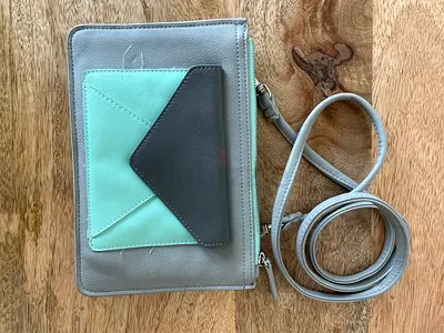 Small grey crossbody bag with mint envelope pocket - light wear