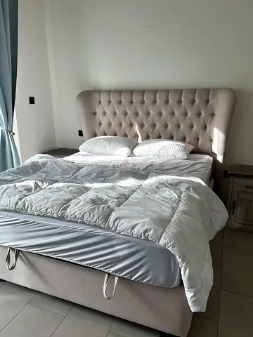 Upholstered tufted queen bed frame with headboard (light beige) with mattress