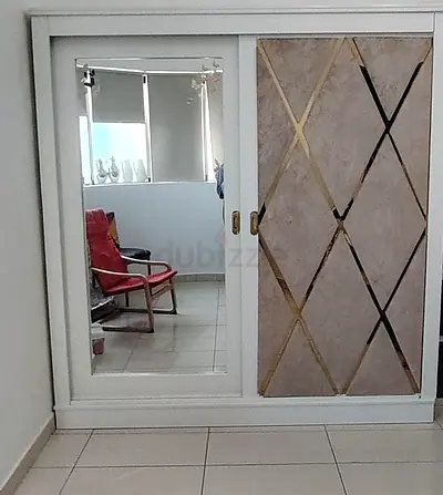 White Sliding Wardrobe with Mirror and Decorative Panel, with 4 partitions.