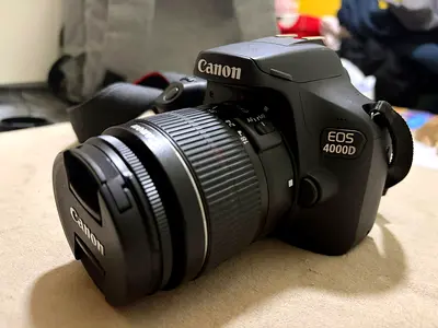 Canon 4000d together with 18-55mm kid lens for sale