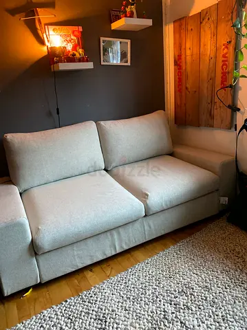 Beige two seater sofa bed with mattress