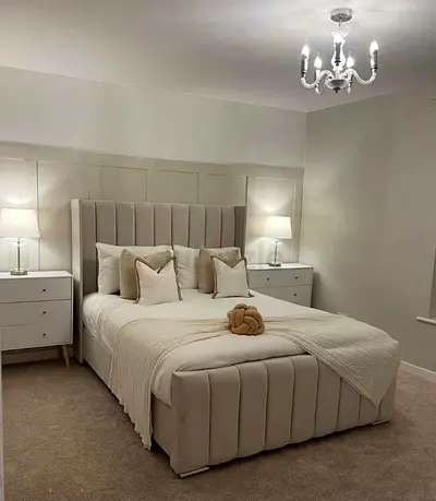 Beige Upholstered Double Bed with Padded Headboard and Storage Base