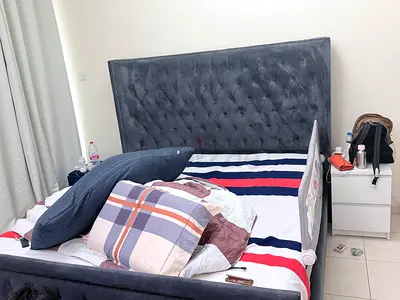 Queen upholstered bed with tufted headboard - grey