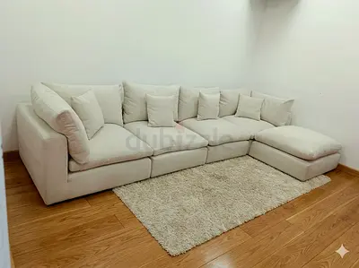 The One Brand off white color modular sofa with ottoman