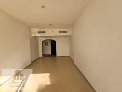 Two-bedroom apartment with a living room in Sharjah, specifically in the Al Khan area, close to all