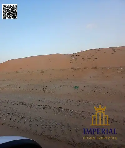أرض تجارية مميزة للبيع في منطقة الحليو 2 – عجمان، تقع في موقع استراتيجي مقابل مجمع أزهي مباشرة