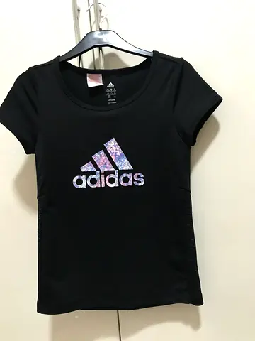 Adidas black top for kids aged 11-12 for 50 aed.