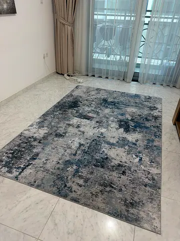 Large modern abstract area rug in blue and grey tones