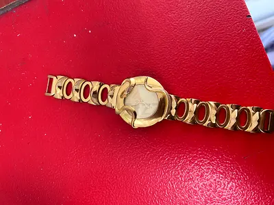 Gold-tone ladies wristwatch with unique circular link bracelet