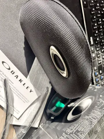 Oakley Glasses ( brand new ) used once only with case and extra sides