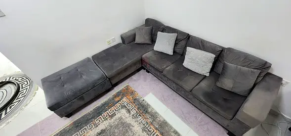 Grey L-shaped Fabric Sofa with Ottoman - Good Condition