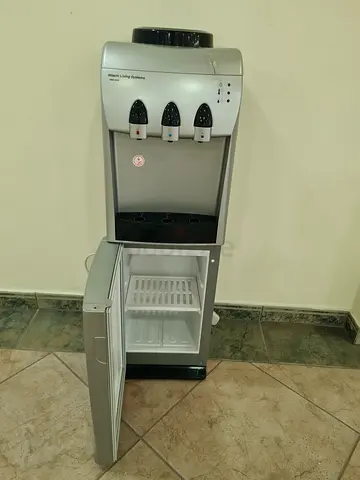 Water Dispenser with storage cabinet - Standing Cooler (minor crackon the top right)