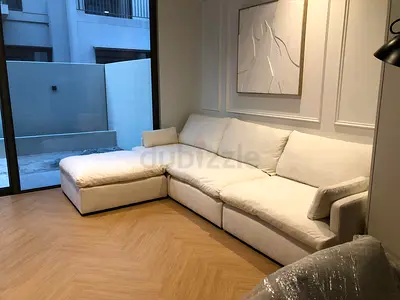 Great condition home center white color feather 🪶 filled modular sofa with ottoman