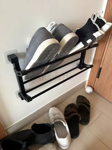 Wall-mounted shoe rack — compact metal organizer, good condition