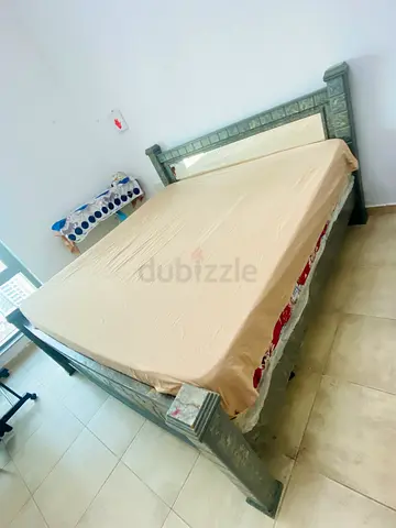 King size wooden bed with mattress
