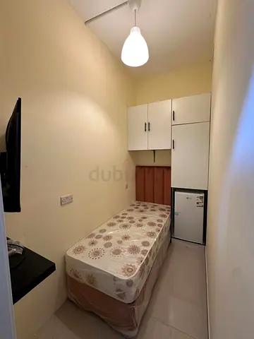 Available soundproof single partition with smart tv and fridge in silicon oasis