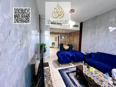Two-bedroom apartment with a living room for sale in cash in Ajman One Towers, with an open view and a closed kitchen.