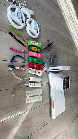 Nintendo Wii console with remotes, nunchuks, steering wheels and sensor bar - good working condition