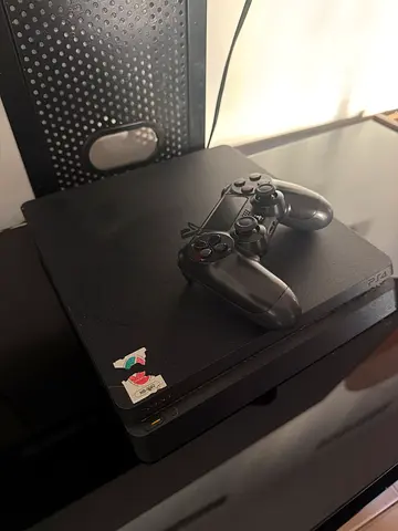 PlayStation 4 and a controller for sale
