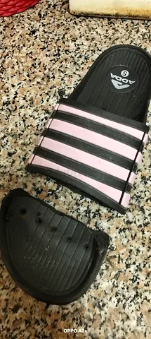 Pair of black  pink slide sandals (one broken strap) - size unknown