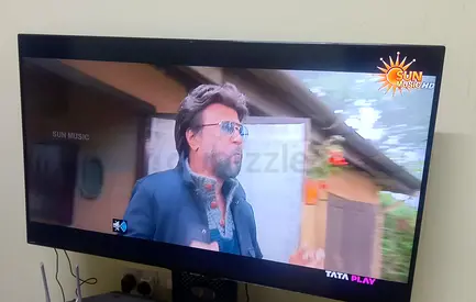 50-inch LED TV in good working condition with tempered table stand and fire stick