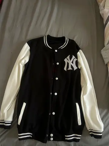 Black and white varsity jacket with NY logo Size M