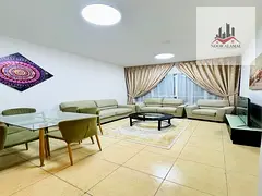 Sharjah, Al Khan: One bedroom apartment with living room, kitchen, two bathrooms, and balcony overlo
