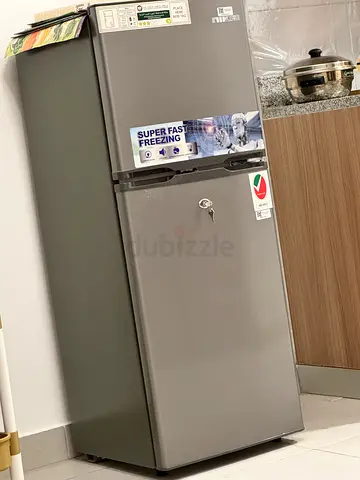 Used double-door refrigerator in good condition (gray)