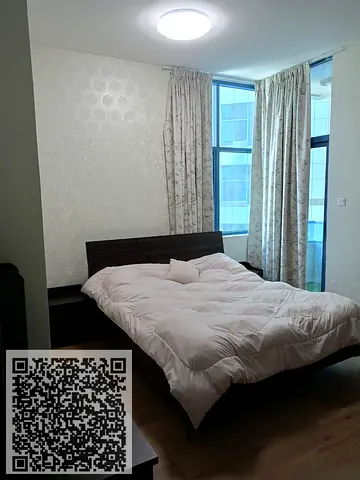 Two-bedroom apartment for sale in Falcon Towers, Al Rashidiya 2, Ajman, with installments available. High floor with parking.