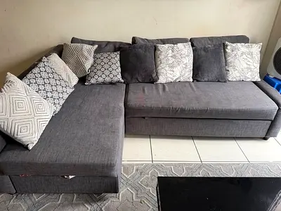 L-shaped grey fabric sectional sofa with storage, good condition