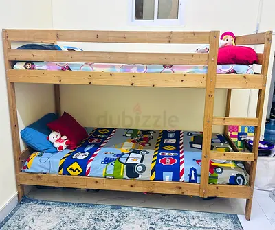 IKEA wooden bunk bed with 2 mattresses - good condition