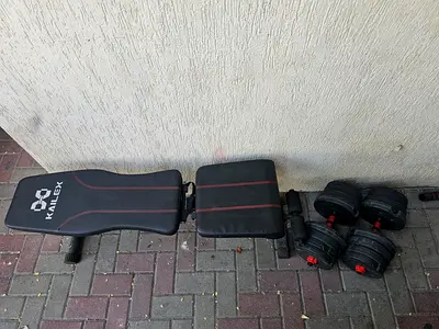 Adjustable workout bench with removable dumbbells