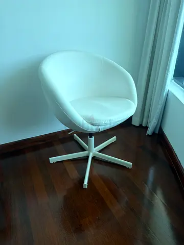 White swivel lounge chair with modern curved design