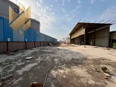 Large yard in Al Sajaa, 20,000 sq. ft. with worker accommodation (6 rooms), kitchen, and 70 kW elect