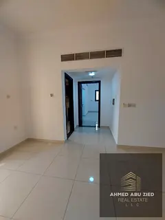 Spacious 1BR apartment for annual rent in Ajman, balcony with open view, central AC, 2 baths, 4–6 