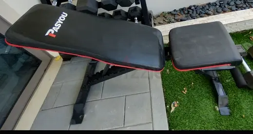 Adjustable weight bench with leg support - good condition