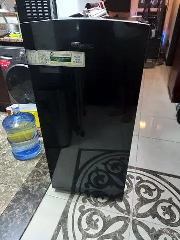 Single-door black refrigerator - good working condition read description