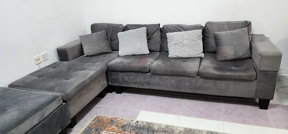 Grey L-shaped Fabric Sofa with Ottoman - Good Condition