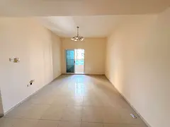 t1 bedroom hall | Balcony open view | Central AC | Prime Dubai exit location