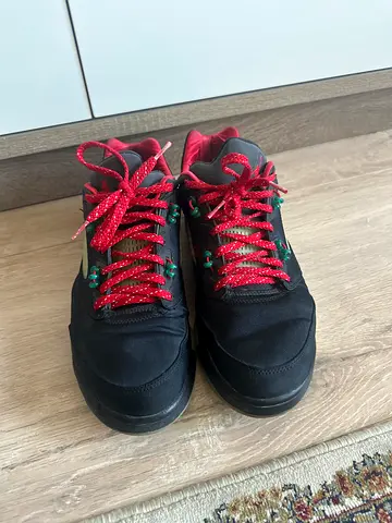 Black Jordans with red laces, moderately used (no original box)