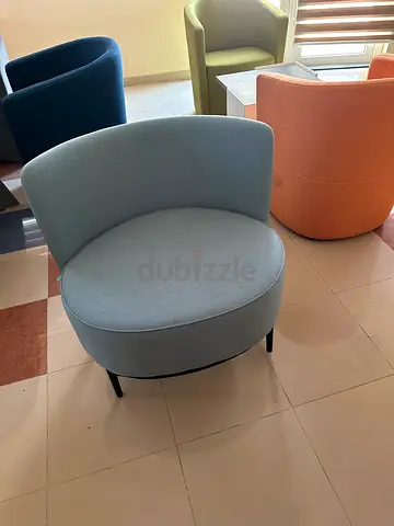 Light blue round accent chair with low back — good condition